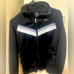 A size small P Nike zip up black with grey and white stripes.